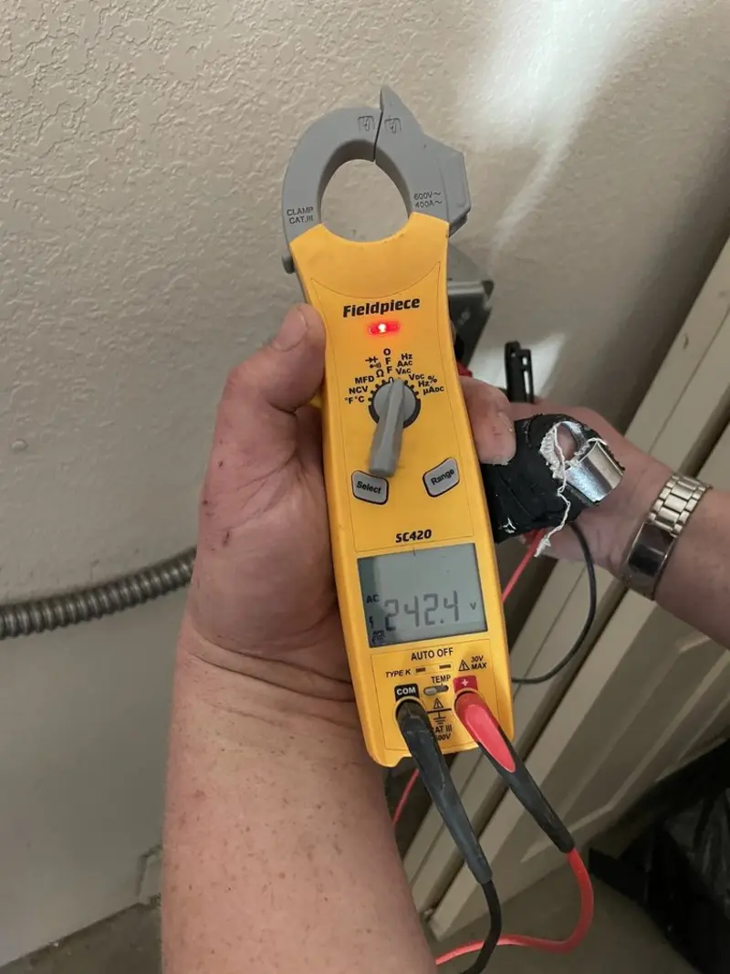 Voltage testing with clamp meter during Whole House Surge Protector in Moundsville